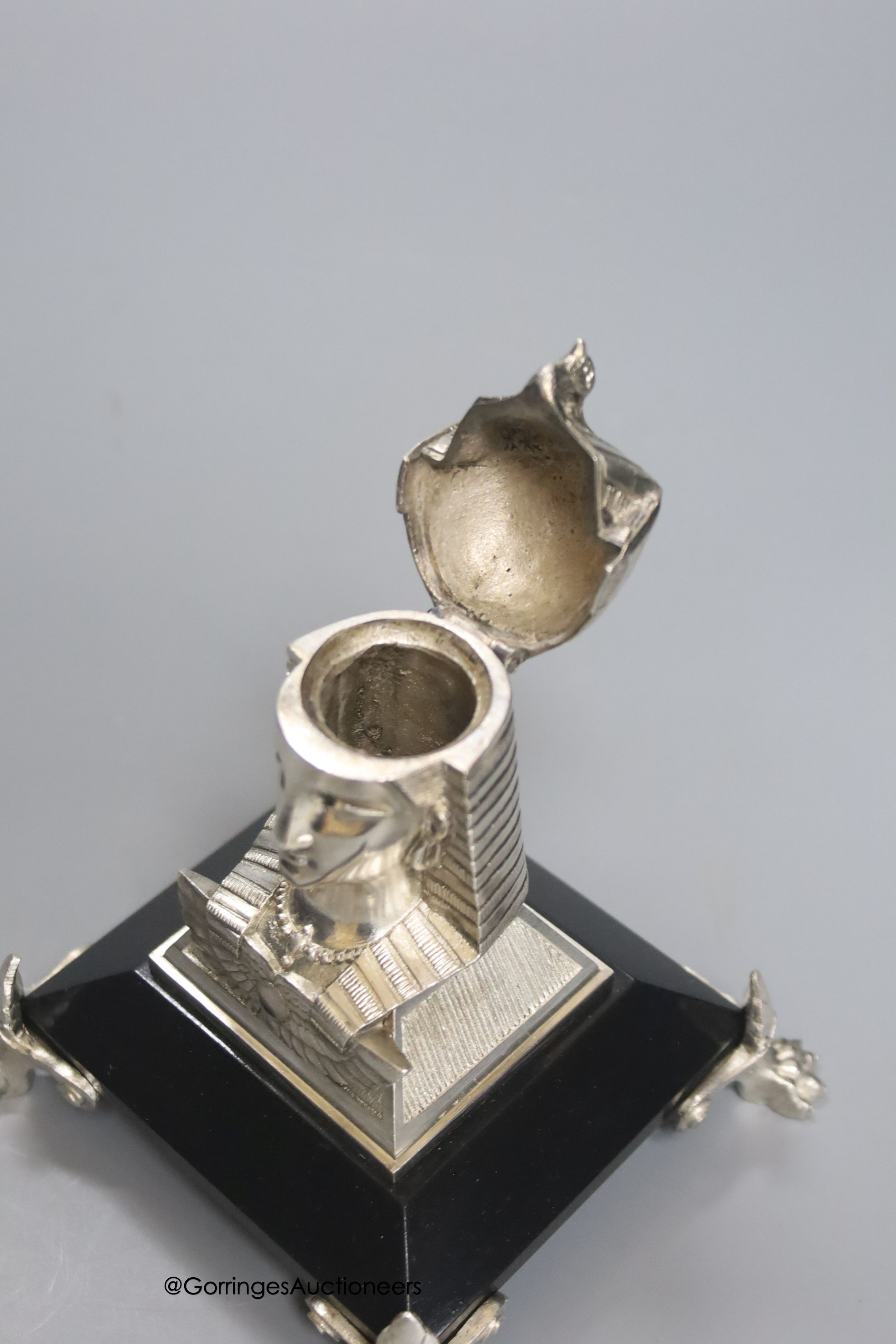 An Egyptian style electroplate mounted inkwell, height 12cm